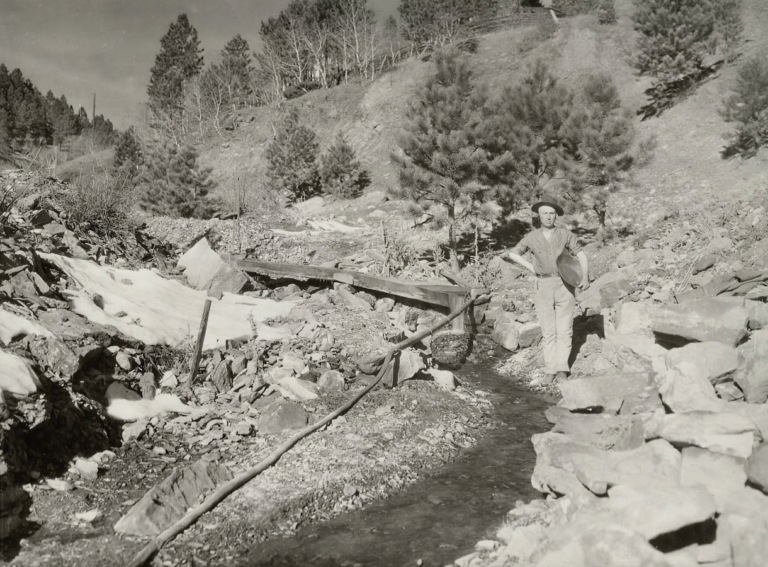 William Remer standing next to a placer mine, undated. Deadwood History, Inc., Adams Museum Collection.